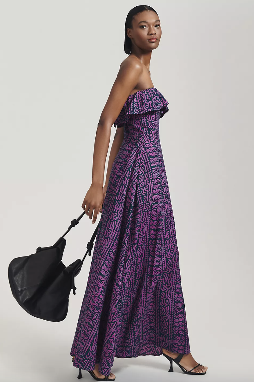 model in purple and dark green Kahindo Strapless Ruffled Maxi Dress (photo via Anthropologie)