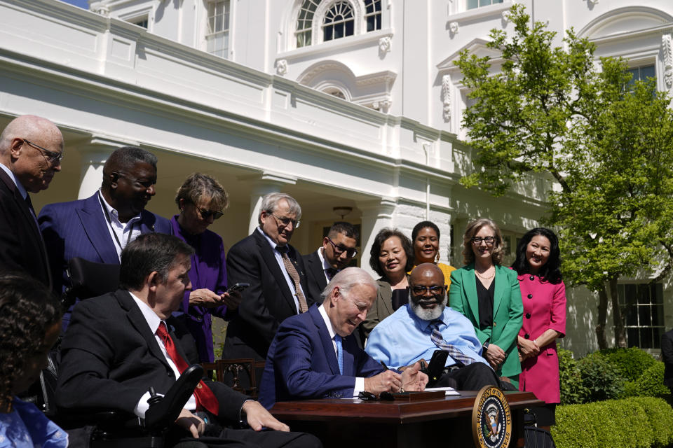 FILE - President Joe Biden signs an executive order to increase access to child care and improve the work life of caregivers in the Rose Garden of the White House in Washington, Tuesday, April 18, 2023. (AP Photo/Patrick Semansky, File)