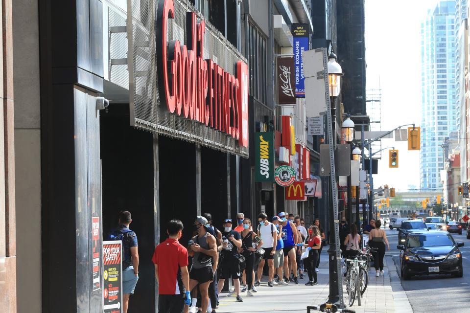 TORONTO, ON - JULY 31: Goodlife Fitness  on Yonge opened today to lines of fit patrons waiting to get back in the gym.        (Rene Johnston/Toronto Star via Getty Images)