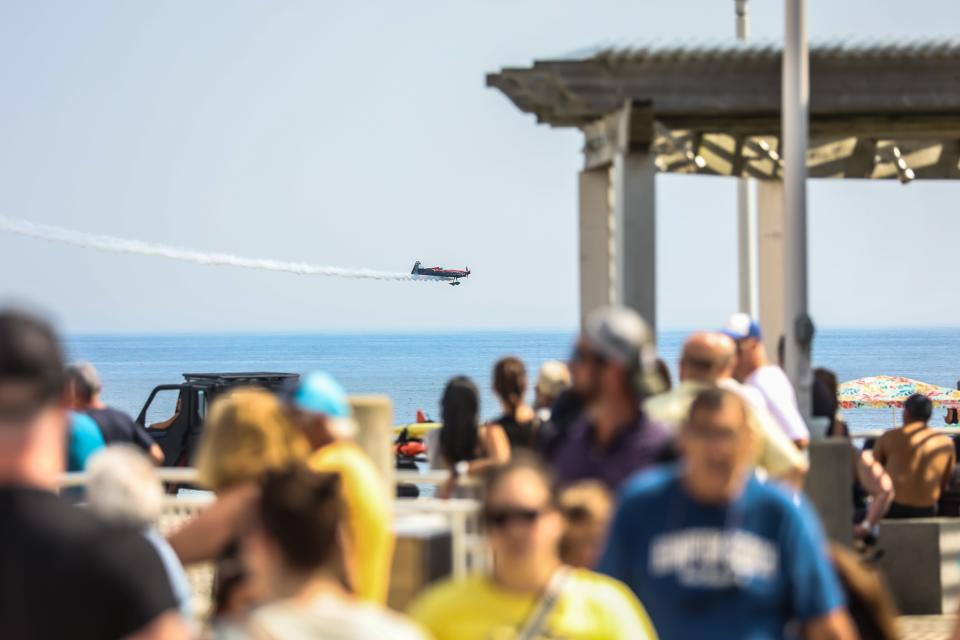 Rob Holland, a highly accomplished aerobatic pilot, performs aerial tricks in his stunt plane at the 34th Hampton Beach Seafood Festival on Saturday, Sept. 9, 2023.