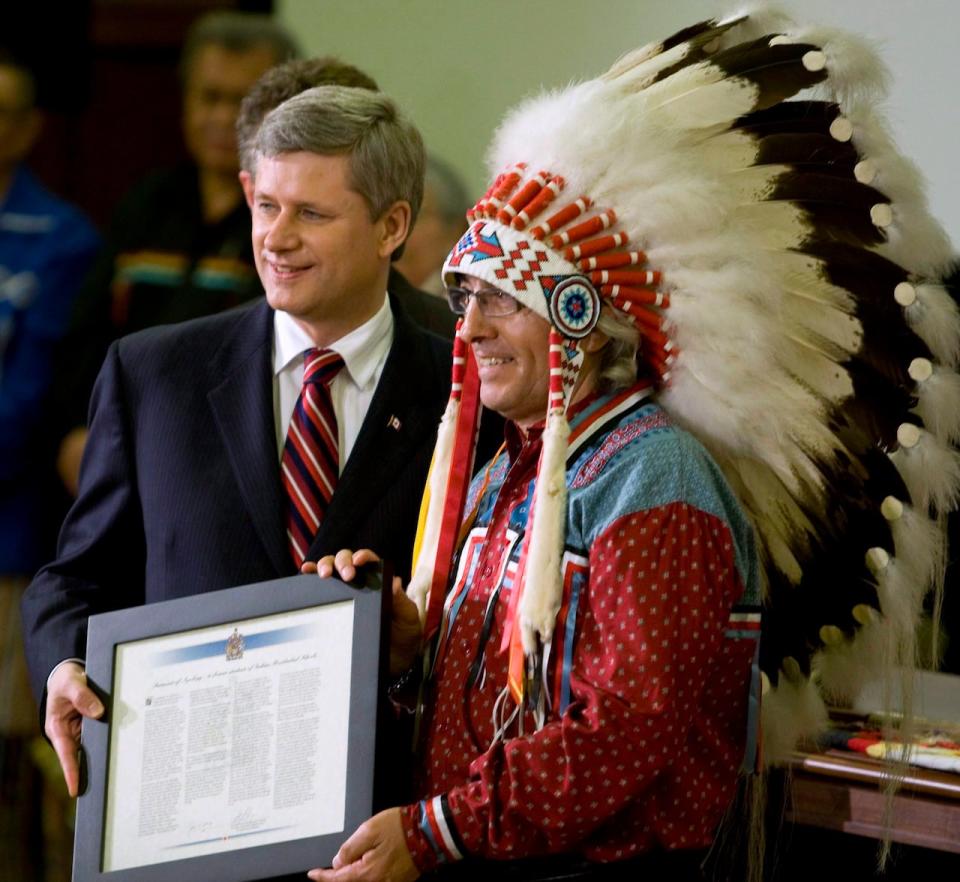  "Today is the result of the righteousness of our struggle," said Assembly of First Nations Chief Phil Fontaine after the apology. In this photo, he is presented with a citation by Prime Minister Stephen Harper, left, in the House of Commons on June 11, 2008. 