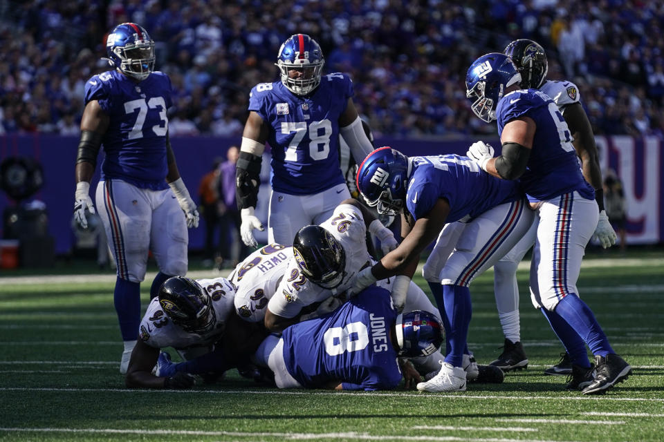 The New York Giants offensive line looks on as their quarterback Daniel Jones (8) is sacked during the second half of an NFL football game against the Baltimore Ravens, Sunday, Oct. 16, 2022, in East Rutherford, N.J. (AP Photo/Seth Wenig)