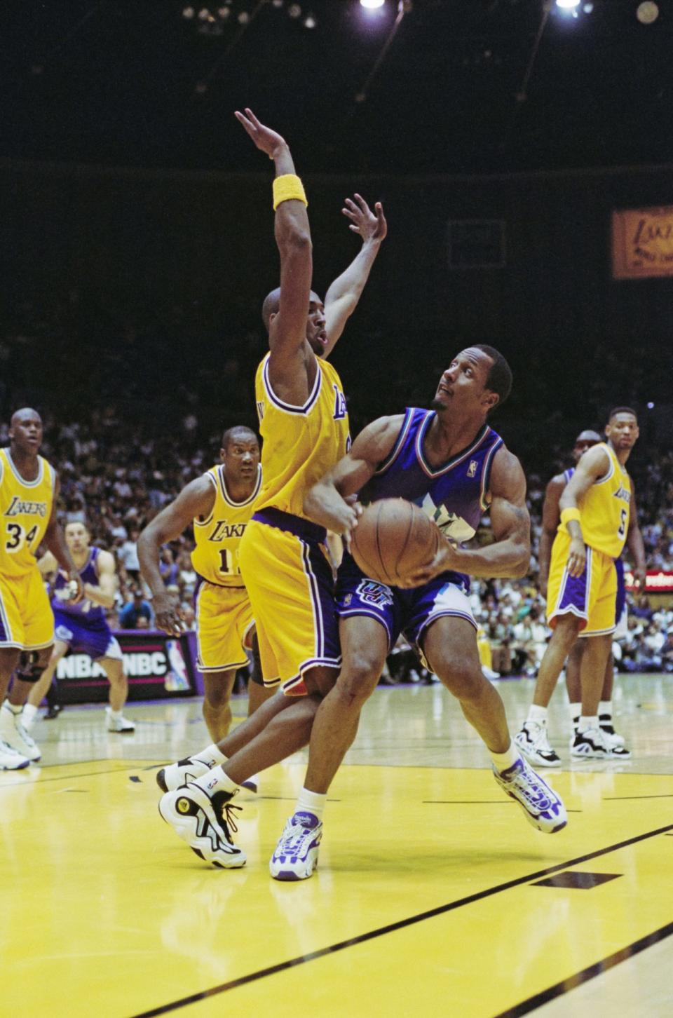 Shandon Anderson #40, Shooting Guard and Small Forward for the Utah Jazz is blocked by #8 Kobe Bryant of the Los Angeles Lakers during their NBA Pacific Division basketball game on 13th April 1997 at The Forum arena in Inglewood, Los Angeles, California, United States The Lakers won the game 100 – 98. (Photo Harry How/Allsport/Getty Images) - Credit: (Photo Harry How/Allsport/Getty Images)