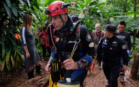 British cave-diver Richard William Stanton walks out from Tham Luang Nang Non cave in full kit - Credit: Linh Pham /Getty