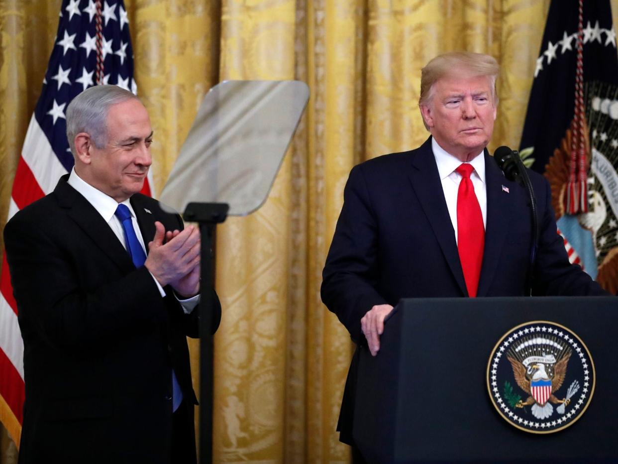 Donald Trump, alongside Benjamin Netanyahu, announces his peace deal in Washington yesterday: AP