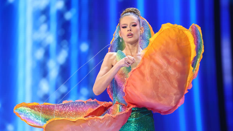 Another floral moment came from Miss Netherlands, whose runway reveal saw her peel back the petals of a rainbow-patterned tulip — a metaphor for her evolution "into the proud woman she is today," pageant commentators explained. - Hector Vivas/Getty Images
