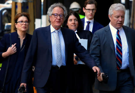 Australian actor Geoffrey Rush reacts as he arrives at the Federal Court in Sydney, Australia, November 8, 2018. REUTERS/David Gray/Files