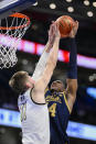 Wake Forest forward Andrew Carr (11) blocks a shot by Notre Dame forward Kebba Njie (14) during the first half of an Atlantic Coast Conference second round NCAA college basketball tournament game Wednesday, March 13, 2024, in Washington. (AP Photo/Nick Wass)