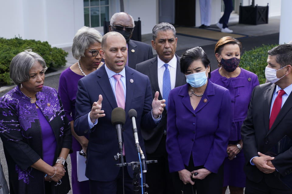 Rep. Hakeem Jeffries, D-N.Y., standing with other House Democrats, talks to reporters outside the West Wing of the White House in Washington, Tuesday, Oct. 26, 2021, following a meeting with President Joe Biden to work out details of the Biden administration's domestic agenda. (AP Photo/Susan Walsh)