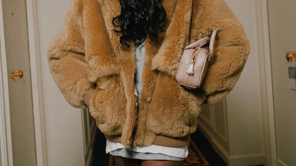 a person wearing a fur coat