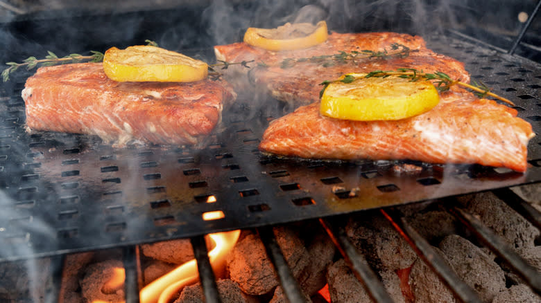 Salmon with lemon on grill