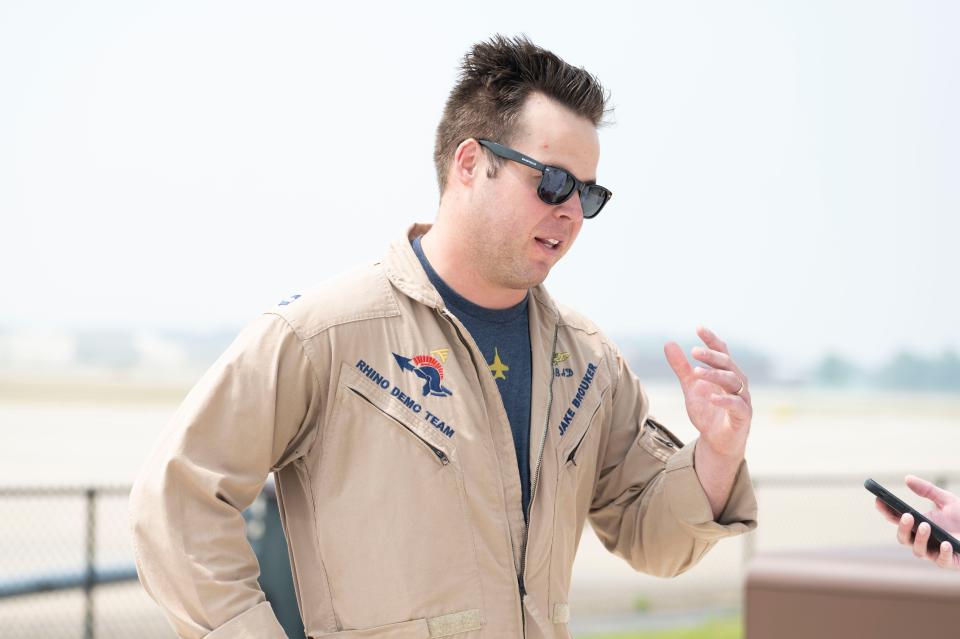 Lt. Jake Brouker of the U.S. Navy Rhino Demo Team speaks ahead of the Field of Flight air show at Western Michigan University College of Aviation in Battle Creek on Thursday, June 29, 2023.