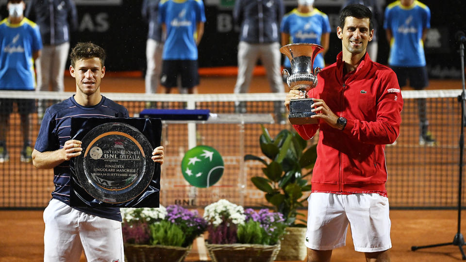 Diego Schwartzman and Novak Djokovic, pictured here with their respective trophies after the Italian Open final.