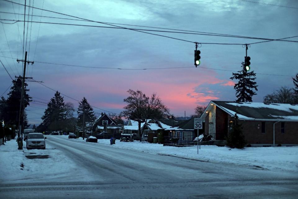 Roads are icy along SE Duke near 72nd Ave., in southeast Portland on Tuesday Jan. 17, 2017. The Portland, Oregon area is bracing for freezing rain that could bring up to an inch of ice to some areas east of the city, with heavier accumulations in the Columbia River Gorge. (Dave Killen/The Oregonian via AP)