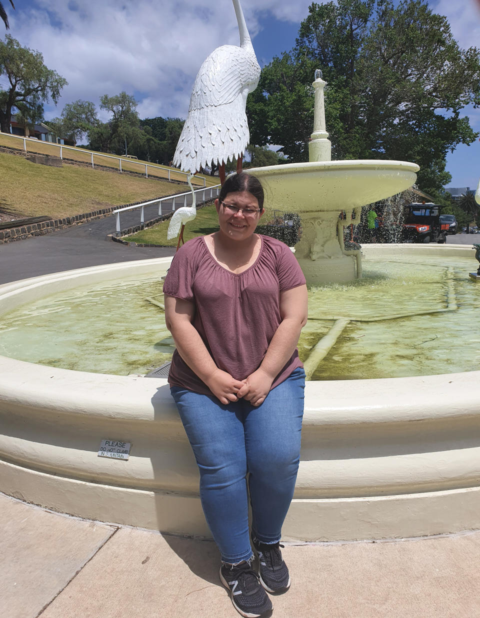 Crystal is seen standing in front of a fountain. Source: Supplied 