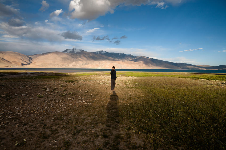 February 2: Just by the lake, Ladakh, India by sandeepachetan.comTso Moriri, at a distance of 250km from Leh is a high mountain lake at a height of around 4500m. We were walking towards Tso Moriri and I saw the concentrated natural light at one place. My friend was standing right in the centre of the light and the sun was about to set. Warm light, long shadows, beautiful Tso Moriri lake in the background created the right moment to take this shot. All I did, was align myself (my shadow) to create a magnificent levitating effect to figure in the centre.