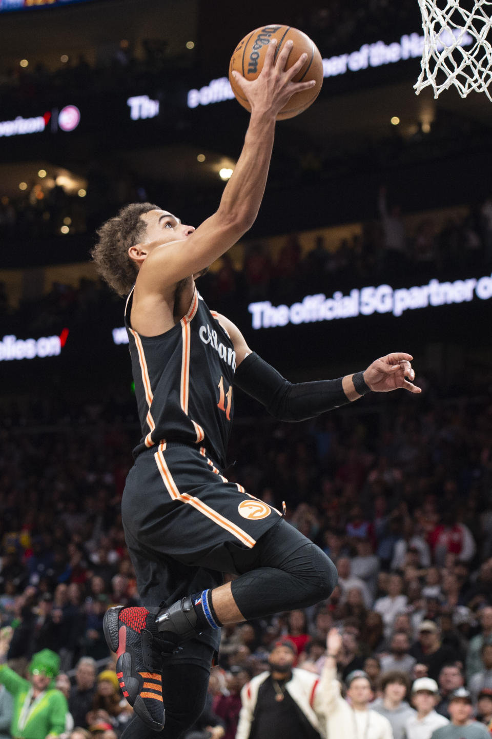 Atlanta Hawks guard Trae Young scores during the second half of an NBA basketball game against the Golden State Warriors, Friday, March 17, 2023, in Atlanta. (AP Photo/Hakim Wright Sr.)