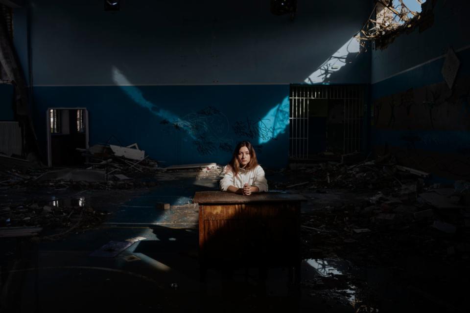 Daria Kechenovska sits inside her destroyed school in Zhytomyr (Diego Ibarra Sánchez/Unicef)
