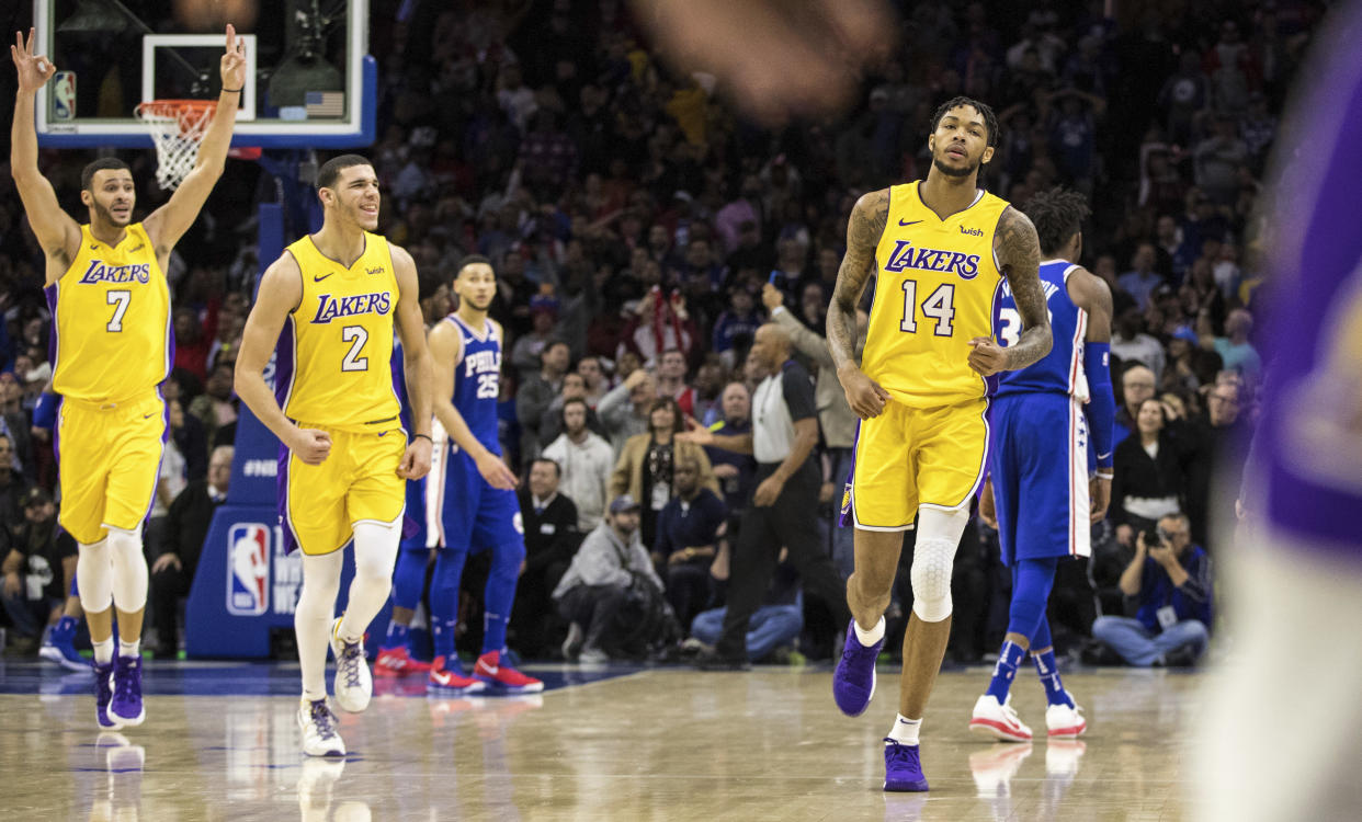 You can play it cool all you like, Brandon Ingram, but Larry Nance Jr. and Lonzo Ball are very excited you made that game-winning 3-pointer. (AP)