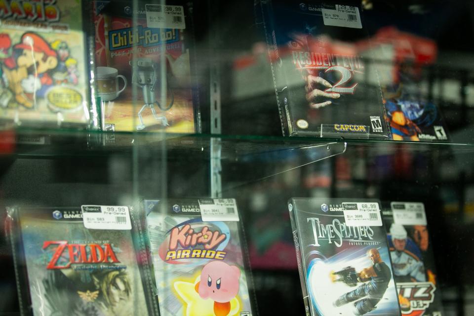 Video games are on display at the new location of Tronix Repair & Games Wednesday, Jan. 3, 2024.