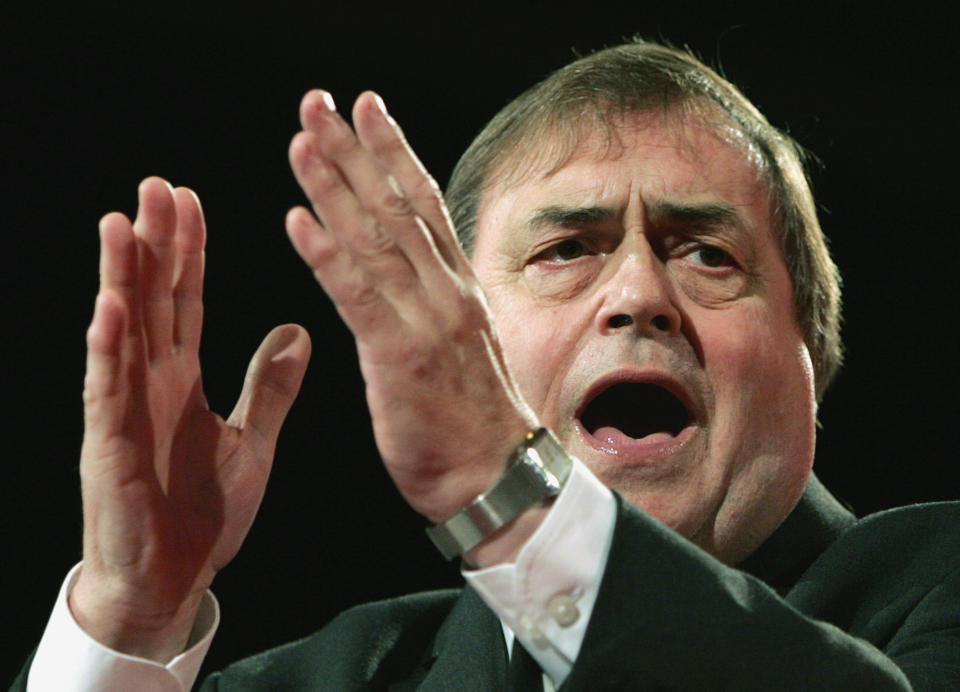 FILE- This Sunday Sept. 25, 2005 file photo shows Britain's Deputy Prime Minister John Prescott makes a speech at the Labour Party Conference, Brighton, England. On Tuesday, July 24, 2012, British prosecutors announced charges against eight people alleged to have been involved in a phone hacking scheme with more than 600 targets. Some of the prominent alleged victims of the phone hacking are thought to have included, Paul McCartney, Heather Mills, Angelina Jolie, Brad Pitt, Jude Law, Sadie Frost, Sienna Miller, Wayne Rooney, Sven-Goran Eriksson, Lord Frederick Windsor, John Prescott, as well as murdered 13-year old school girl who was abducted in 2002 Amanda "Milly" Dowler. (AP Photo/Kirsty Wigglesworth, File)