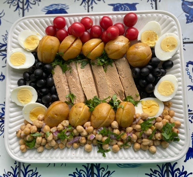 Maria Lawton, also known as the Azorean Green Bean, makes a quick meal with tuna, chick peas, hard boiled eggs, grape tomatoes and new potatoes.