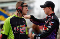 AVONDALE, AZ - NOVEMBER 11: Denny Hamlin (R), driver of the #11 FedEx Freight Toyota, talks with Dave Rogers (L), crew chief for the #18 Interstate Batteries Toyota, during practice for the NASCAR Sprint Cup Series Kobalt Tools 500 at Phoenix International Raceway on November 11, 2011 in Avondale, Arizona. (Photo by Geoff Burke/Getty Images for NASCAR)