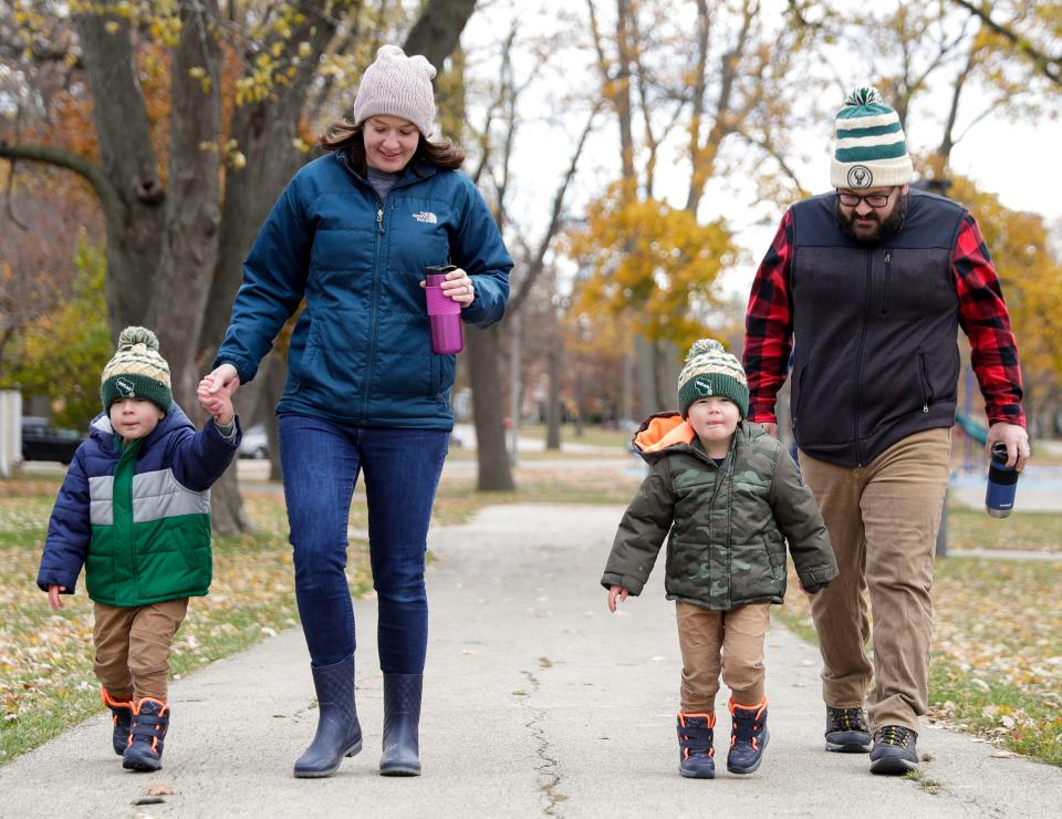 (Left)Jack and (right) Raymond Honeck enjoy a walk around the park with parents Michelle and Nick Honeck from Milwaukee on a brisk day on Saturday, November 13, 2021 at Humboldt Park in Milwaukee, Wis.