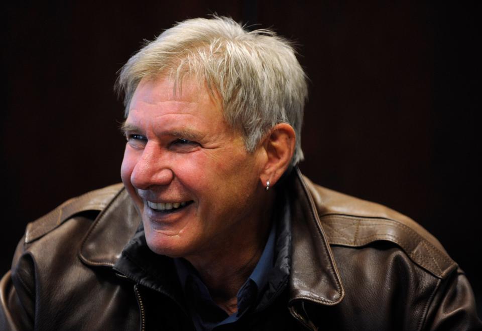 harrison ford smiling with earring