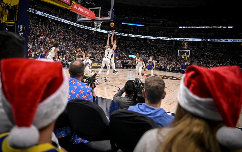 Fans attend an NBA game in Denver on Christmas in 2023.