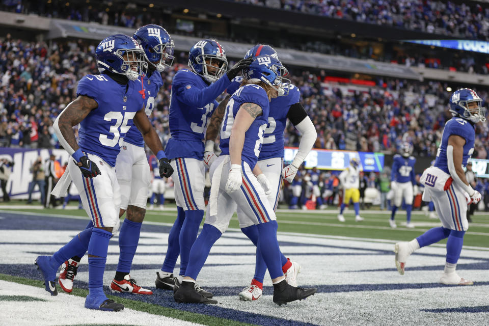 New York Giants wide receiver Gunner Olszewski (80) celebrates after running in a touchdown on a punt return during the second half an NFL football game against the Los Angeles Rams, Sunday, Dec. 31, 2023, in East Rutherford, N.J. (AP Photo/Adam Hunger)