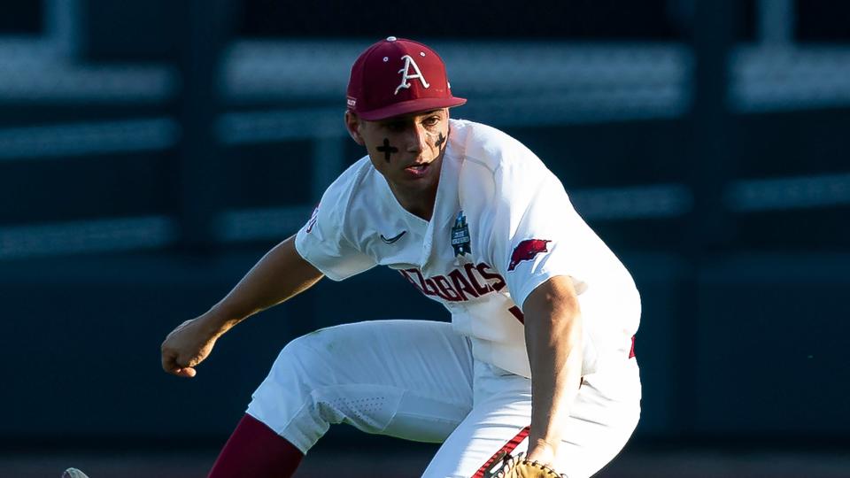 Arkansas second baseman Robert Moore fields the ball against Mississippi in the third inning during an NCAA College World Series baseball game, Monday, June 20, 2022, in Omaha, Neb.