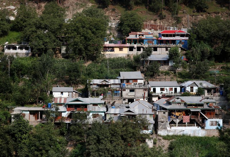 A view shows residential houses in Pakistan administered Kashmir as seen from the Indian administered Kashmir in Teetwal
