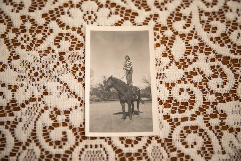 Image: Danielle Stephens riding a horse on the family ranch in Kingman (Joe Buglewicz / for NBC News)