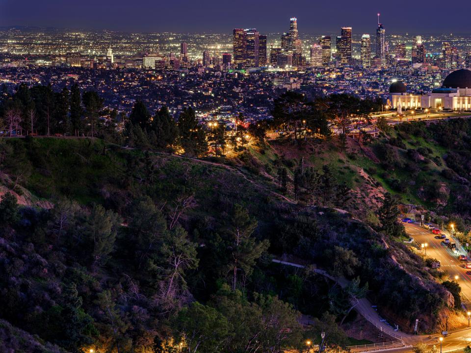 The Los Angeles skyline is seen from Griffith Park, at dusk in Los Angeles, Wednesday, Feb. 9, 2022.