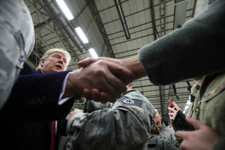 U.S. President Donald Trump greets U.S. troops at Ramstein Air Force Base, Germany, December 27, 2018. REUTERS/Jonathan Ernst