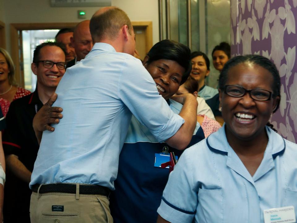 Prince William hugs a worker during a visit to the Royal Marsden in 2019.