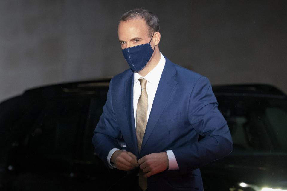 Britain's Foreign Secretary Dominic Raab wearing a protective face covering to combat the spread of the coronavirus, arrives at the BBC in central London on December 13, 2020, to appear on the BBC political programme The Andrew Marr Show. - Sunday is just the latest in a string of supposedly hard deadlines for the negotiations but, with Britain due to leave the EU single market in 19 days, tensions are rising. (Photo by Tolga Akmen / AFP) (Photo by TOLGA AKMEN/AFP via Getty Images)