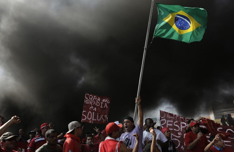 Members of Brazil's Homeless Workers' Movement block a road during a protest against the 2014 World Cup in Sao Paulo