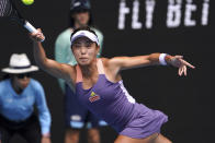 China's Wang Qiang makes a forehand return to Serena Williams of the U.S. in their third round match at the Australian Open tennis championship in Melbourne, Australia, Friday, Jan. 24, 2020. (AP Photo/Lee Jin-man)