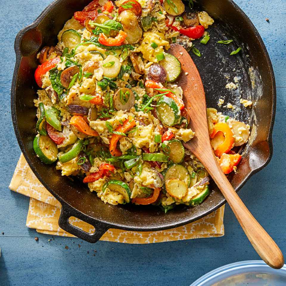 <p>Don't toss out those almost-past-their-prime vegetables and fresh herbs. Toss them into this skillet egg scramble for a quick vegetarian meal. Nearly any vegetable will work in this easy skillet recipe, so choose your favorites or use what you have on hand. <a href="https://www.eatingwell.com/recipe/273189/summer-skillet-vegetable-egg-scramble/" rel="nofollow noopener" target="_blank" data-ylk="slk:View Recipe;elm:context_link;itc:0;sec:content-canvas" class="link ">View Recipe</a></p>