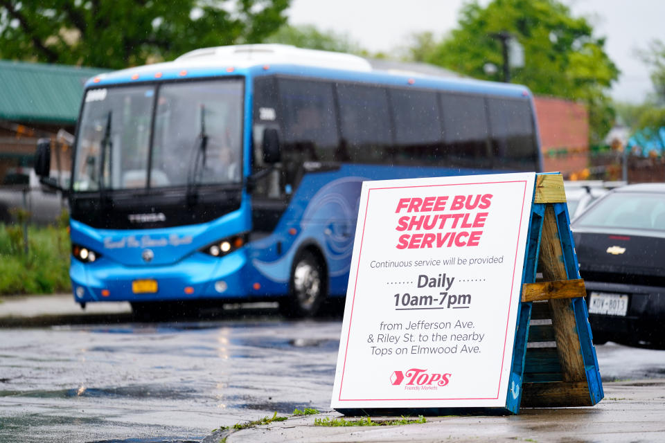 A free shuttle bus waits for residents whose local supermarket has been closed in the aftermath of a shooting, to go to another store to get groceries, in Buffalo, N.Y., Monday, May 16, 2022. (AP Photo/Matt Rourke)