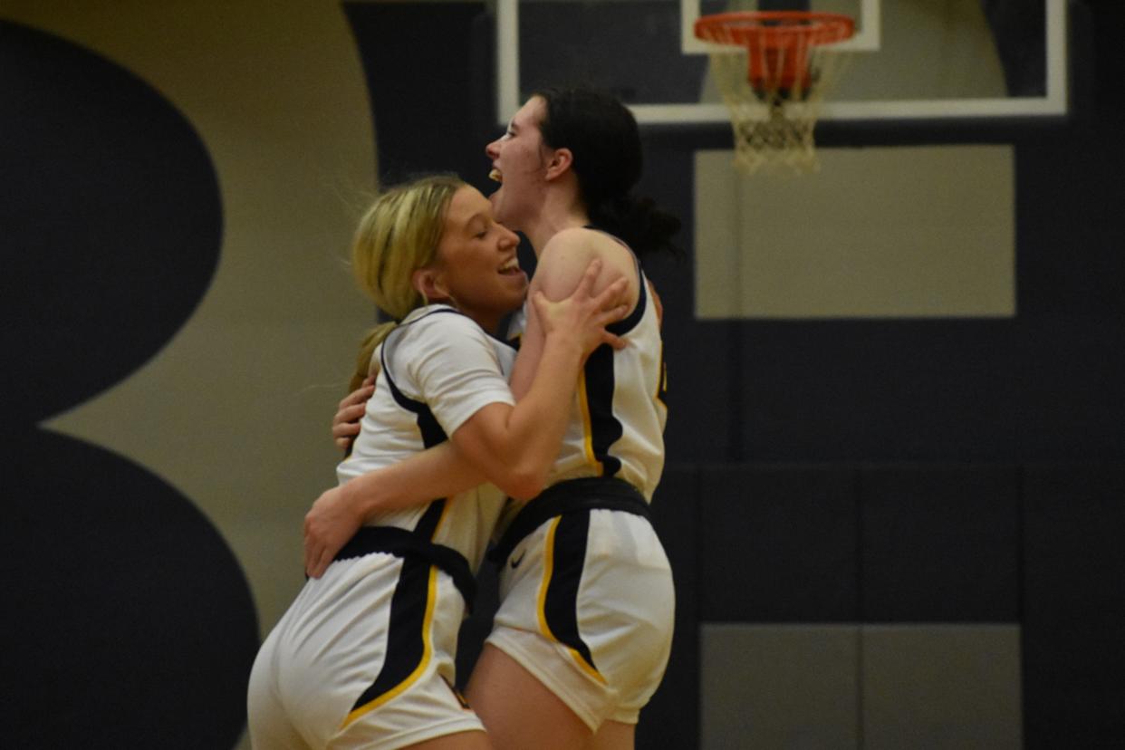 Battle's KJ Johnson and Maliyah Miller celebrate after the final buzzer sounds from the Spartans' win over Rock Bridge on Dec. 6, 2022, at Battle High School in Columbia, Mo.