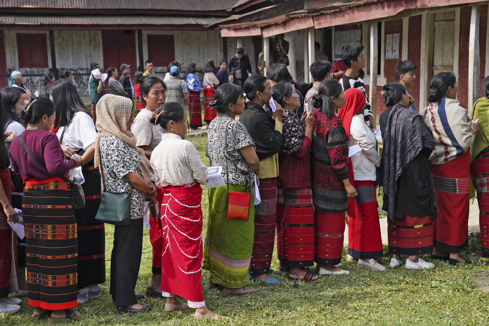Tangkhul Nagas stand in a queue to cast their votes in Shangshak village, in the northeastern Indian state of Manipur, Friday, April 26, 2024. (AP Photo/Yirmiyan Arthur)