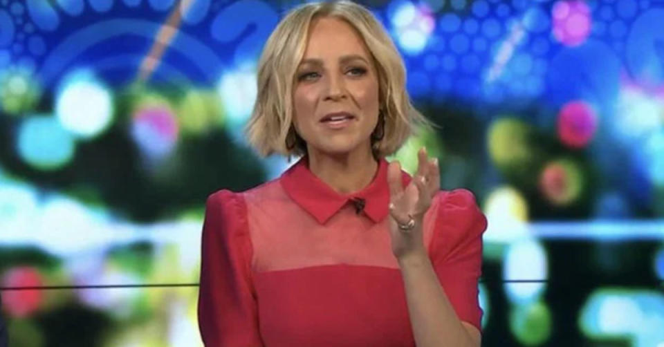 The Project host Carrie Bickmore wearing a pink collared dress on set