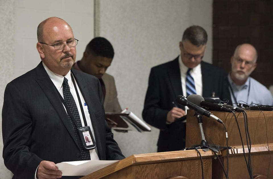Scott Frakes, left, Director of Nebraska Department of Corrections, delivers a statement after the execution of Carey Dean Moore on Tuesday, Aug. 14, 2018. at the Nebraska State Penitentiary in Lincoln, Neb. Nebraska carried out its first execution in more than two decades on Tuesday with a drug combination never tried before, including the first use of the powerful opioid fentanyl in a lethal injection. Moore, 60, was pronounced dead at 10:47 a.m. Moore had been sentenced to death for killing two cab drivers in Omaha in 1979. (Gwyneth Roberts /Lincoln Journal Star via AP)