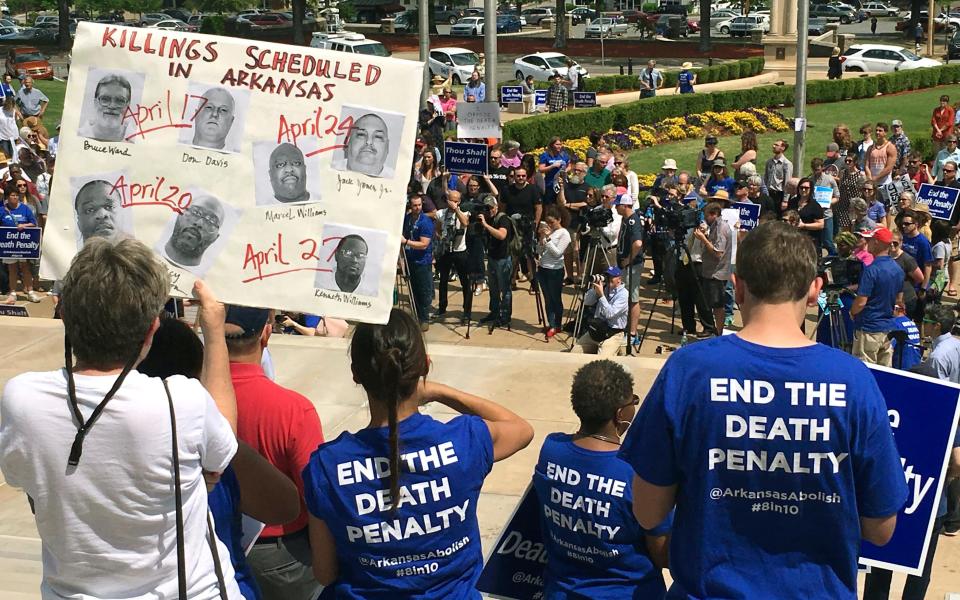 Protesters gather outside Arkansas' Capitol building in Little Rock to voice their opposition to Gov. Asa Hutchinson’s plan to put seven men to death between April 17, and April 27 - Credit: AP