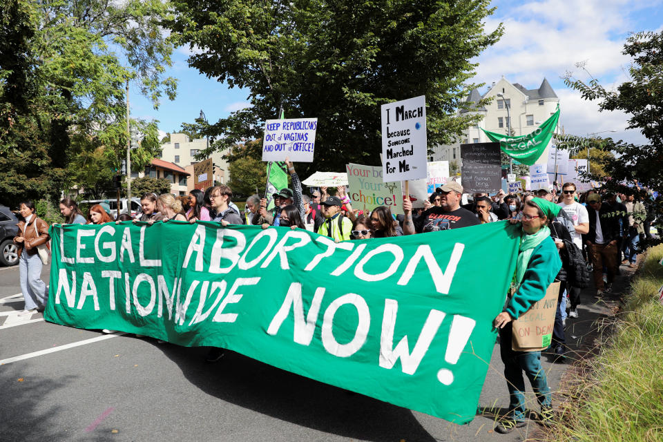 Abortion rights activists participate in a march.