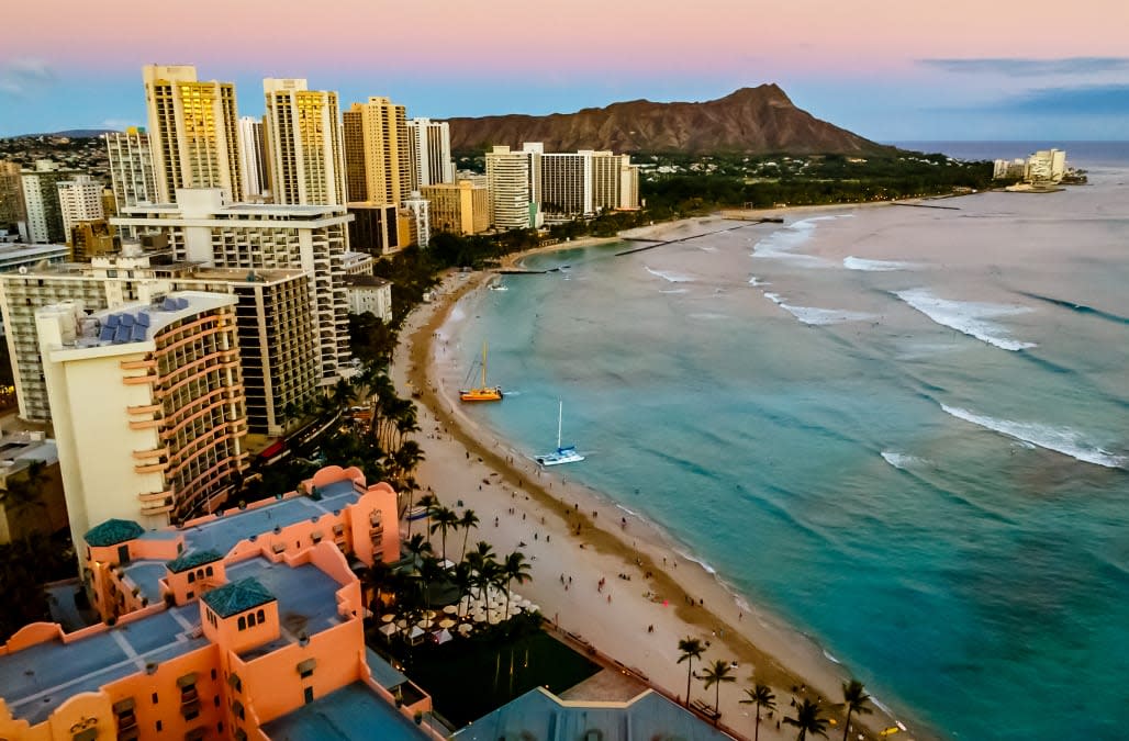 View of Waikiki Beach and Honolulu Skyline at sunset