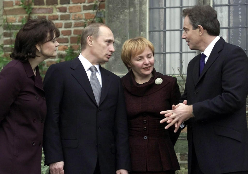 Cherie Blair, left, with the President of the Russian Federation, Vladimir Putin and his wife Lyudmila as they chat with Britain's Prime Minister Tony Blair on the steps of Chequers, the Prime Minister's country residence.  * .... near Wendover  England. The Russian President had arrived for a two day visit for talks.  